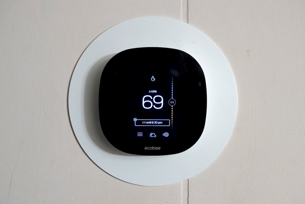 A picture of an adjustable thermostat. Mastering your thermostat settings could be the key to staying cool and comfortable and keeping those energy costs in check!